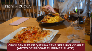 Pareja disfrutando una cena en un restaurante italiano con ambiente cálido y elegante.