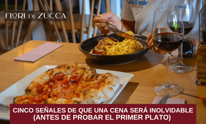 Pareja disfrutando una cena en un restaurante italiano con ambiente cálido y elegante.