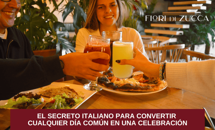 Pareja brindando en un restaurante italiano durante una cena con ambiente cálido y elegante.